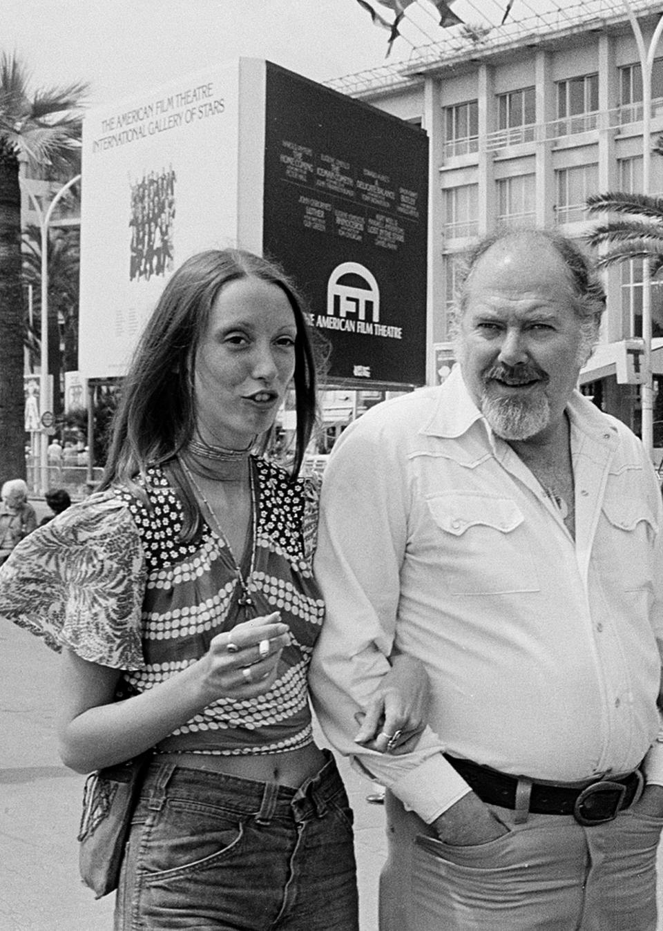 FILE - Shelley Duvall, left, and Robert Altman stroll along the Boulevard de la Croisette in Cannes, France, in May 1974. Duvall, whose wide-eyed, winsome presence was a mainstay in the films of Robert Altman and who co-starred in Stanley Kubrick's “The Shining,” has died. She was 75. (AP Photo/Levy, File)