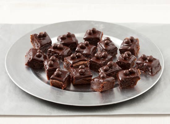 <strong>Get the <a href="http://www.huffingtonpost.com/2011/10/27/bittersweet-chocolate-gla_n_1059536.html" target="_hplink">Bittersweet Chocolate Glazed Espresso Brownie Bites recipe</a></strong>