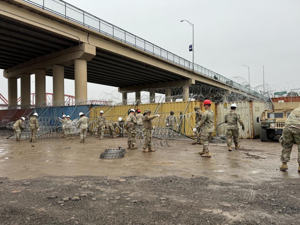 Texas guardsmen set up barriers at Shelby Park in Eagle Pass, Texas, designed to impede the passage of migrants. Jan. 23, 2023.   / Credit: CBS News