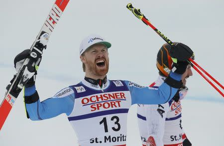 Alpine Skiing - FIS Alpine Skiing World Championships - Men's Giant Slalom - St. Moritz, Switzerland - 17/2/17 - Austria's gold medalist Marcel Hirscher walks past Norway's bronze medalist Leif Kristian Haugen. REUTERS/Ruben Sprich