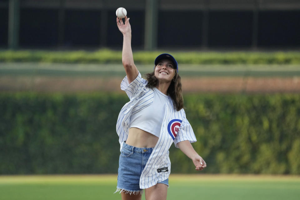 Chicago Red Stars soccer player Sarah Griffith throws out a ceremonial first pitch before a baseball game between the Chicago Cubs and the Cincinnati Reds in Chicago, Thursday, Aug. 3, 2023. (AP Photo/Nam Y. Huh)