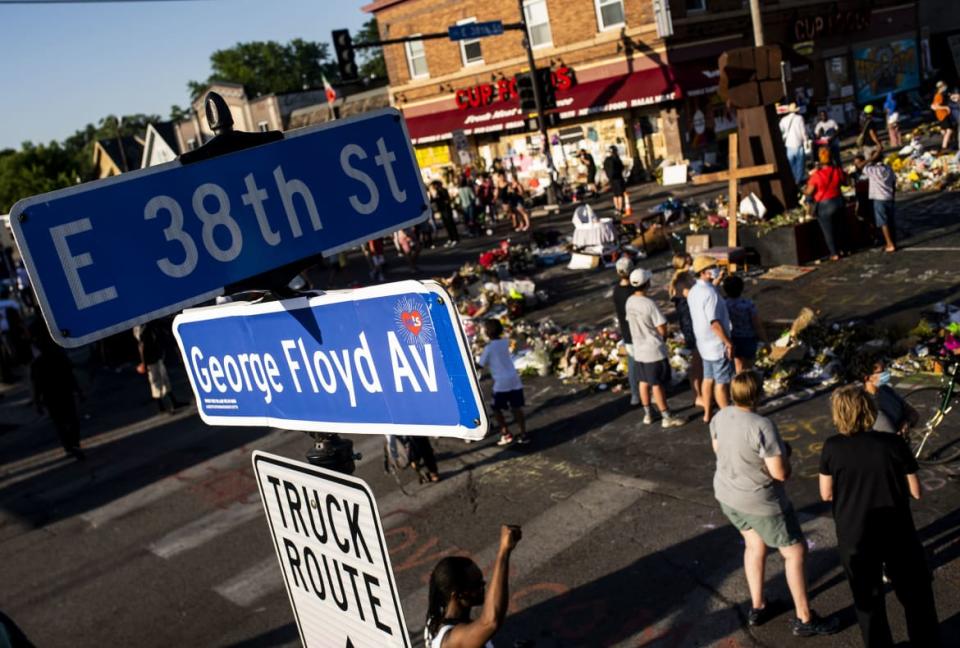 <div class="inline-image__caption"><p>A street sign was pasted over with a decal reading "George Floyd Avenue" on June 8, 2020, in Minneapolis, Minnesota. Floyd died at the cross streets on May 25th while in the custody of the Minneapolis Police Department."</p></div> <div class="inline-image__credit">Stephen Maturen/Getty</div>