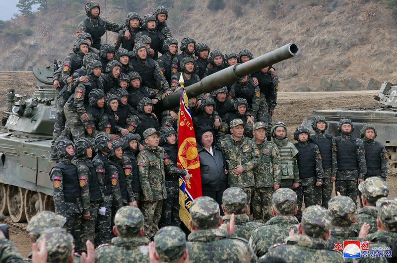 North Korean leader Kim Jong Un guides a military demonstration involving tank units