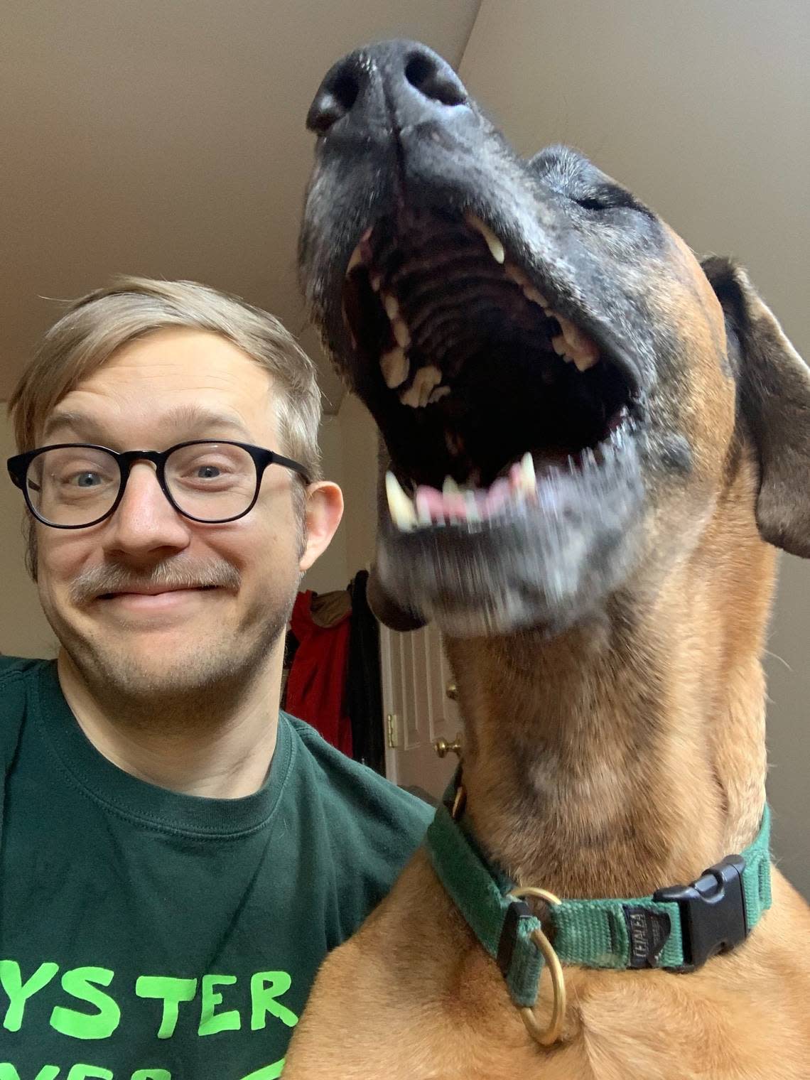 Reporter Drew Jackson with his very large dog Georgia, who found something quite funny.