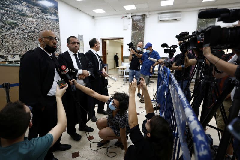 Lawyers representing Malka Leifer, a former Australian school principal accused of sexually assaulting students, speak to members of the media after a verdict was heard in the extradition case against Leifer, at Jerusalem's District Court