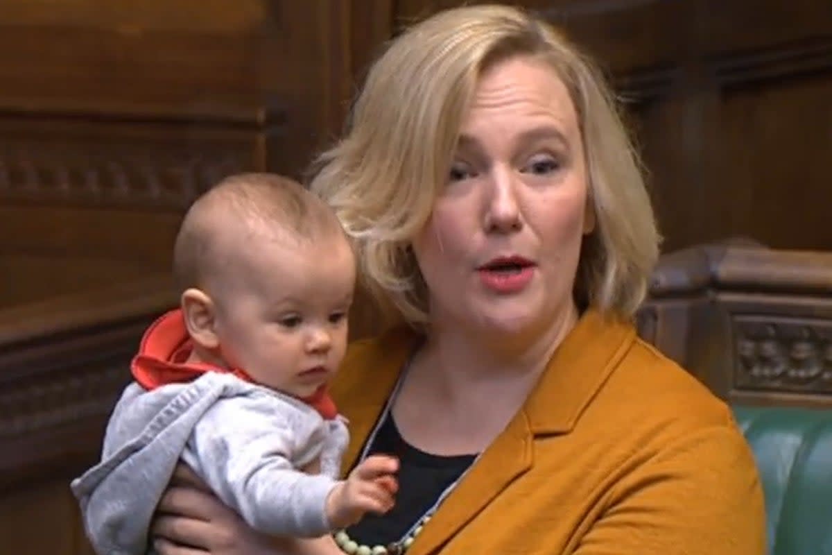 Labour MP Stella Creasy holds her daughter in the House of Commons (House of Commons/PA) (PA Archive)