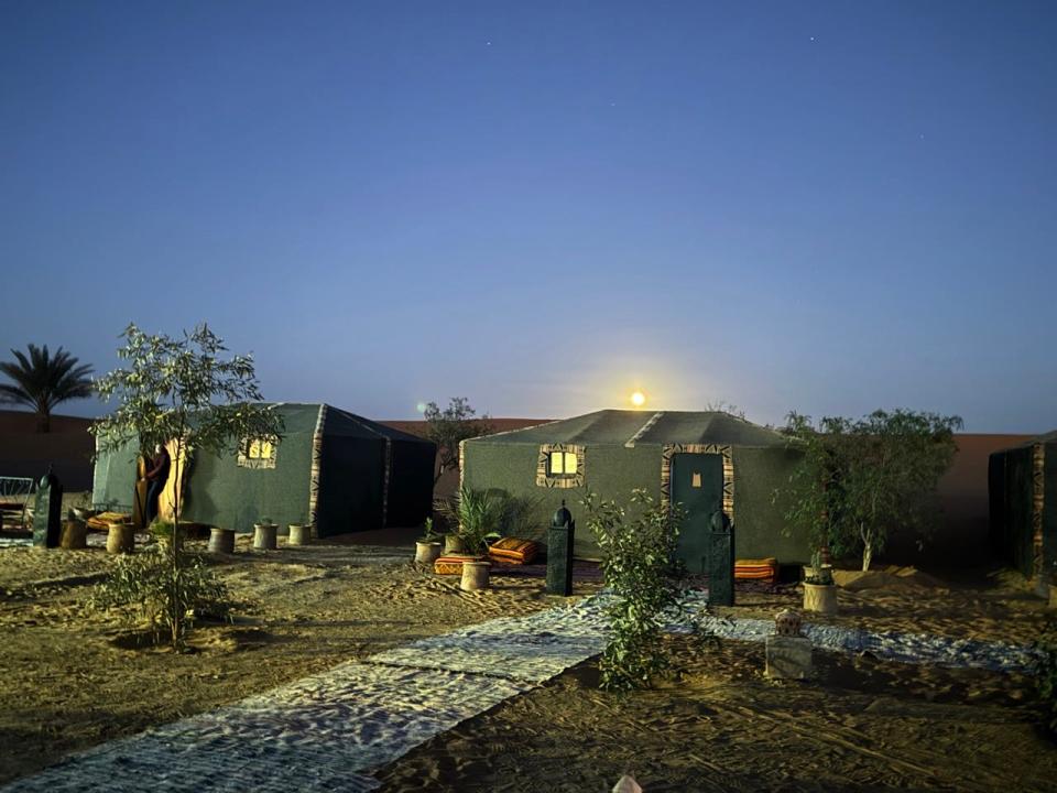 Flamping tents at night in Sahara Desert