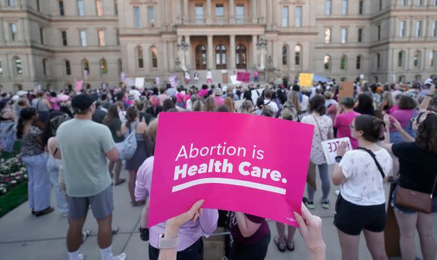 Abortion-rights protesters attend a rally following the United States Supreme Court's decision to overturn Roe v. Wade outside the state capitol in Lansing, Mich., Friday, June 24, 2022. (Photo: via Associated Press)