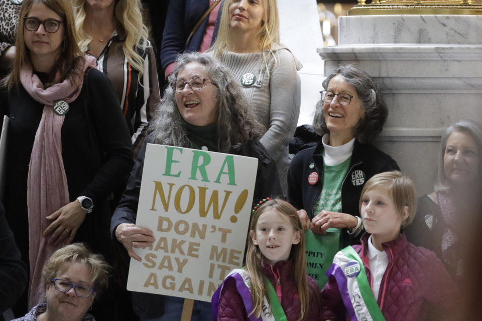 This Tuesday, Dec. 3, 2019, photo, supporters of the Equal Rights Amendment as they rally at the Utah State Capitol, in Salt Lake City. The renewed national push to ratify the Equal Rights Amendment is coming to conservative Utah, where supporters are launching a long-shot bid to challenge Virginia in becoming a potential tipping point despite opposition from the influential Church of Jesus Christ of Latter-day Saints. (AP Photo/Rick Bowmer)