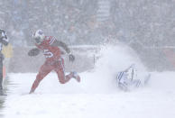 <p>Buffalo Bills running back LeSean McCoy (25) runs past Indianapolis Colts outside linebacker Barkevious Mingo (52) in a snow storm during the first half at New Era Field. Mandatory Credit: Timothy T. Ludwig-USA TODAY Sports </p>