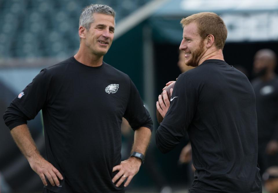 Carson Wentz, right, and Frank Reich talk when both were with the Philadelphia Eagles.