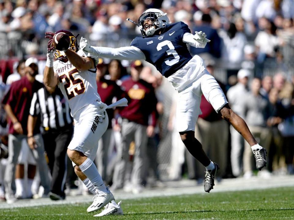 Penn State cornerback Johnny Dixon knocks the ball from Central Michigan’s Noah Koenigsknecht during the game on Saturday, Sept. 24, 2022.