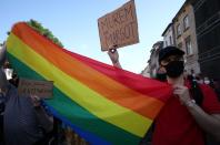 People take part in a rally in support of the LGBT community in Krakow