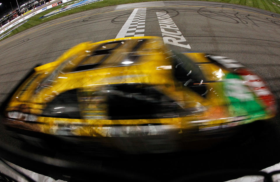 RICHMOND, VA - APRIL 28: Kyle Busch, driver of the #18 M&M's Ms. Brown Toyota, crosses the finish line to win the NASCAR Sprint Cup Series Capital City 400 at Richmond International Raceway on April 28, 2012 in Richmond, Virginia. (Photo by Tom Pennington/Getty Images for NASCAR)