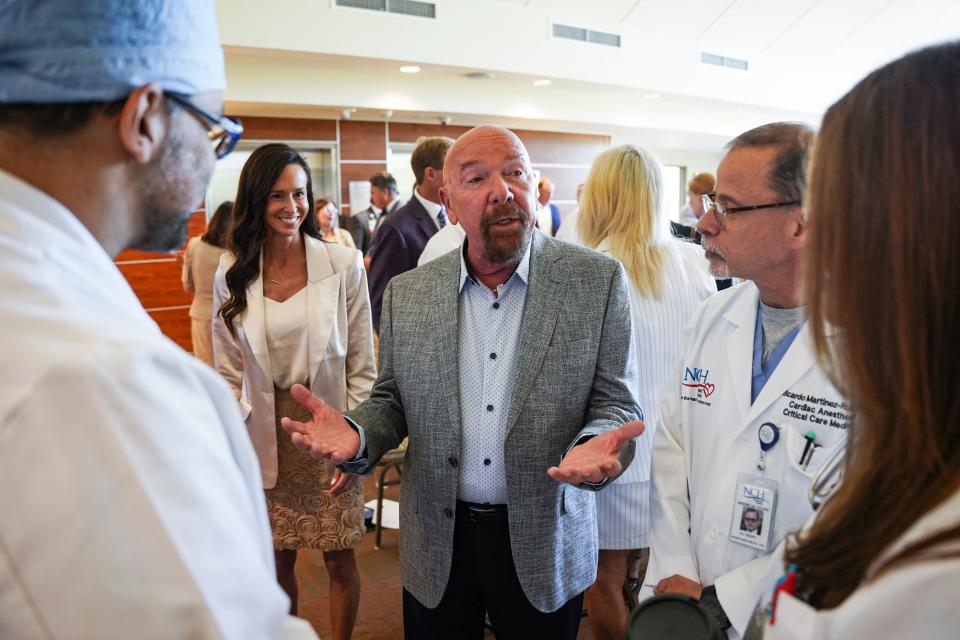 Best Buy founder Dick Schulze speaks with members of the heart center team after he and the Richard M. Schulze Family foundation made a $20 million donation to it at NCH Baker Downtown Hospital in Naples on Wednesday, May 24, 2023.