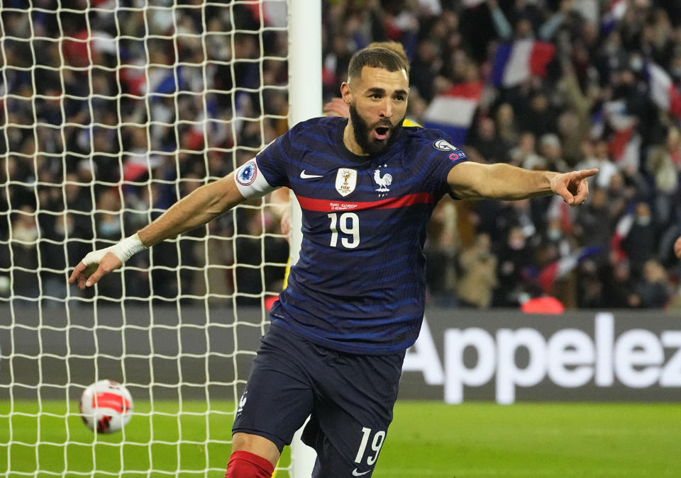 France's Karim Benzema celebrates after scoring his side's fifth goal during the World Cup 2022 group D qualifying soccer match between France and Kazakhstan at the Parc des Princes stadium in Paris, France, Saturday, Nov. 13, 2021. (AP Photo/Michel Euler)