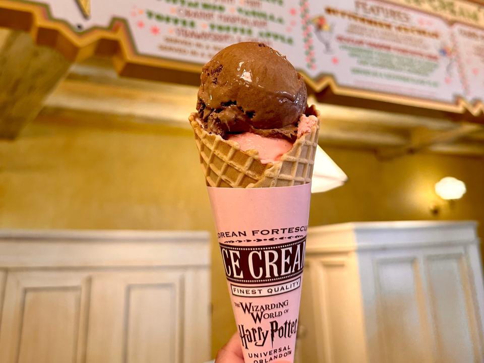 strawberry and chocolate ice cream cone from the shop in the wizarding world at universal