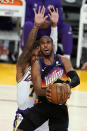 Phoenix Suns guard Chris Paul drives to the basket as Los Angeles Lakers guard Ben McLemore defends during the first half of an NBA basketball game Sunday, May 9, 2021, in Los Angeles. (AP Photo/Marcio Jose Sanchez)