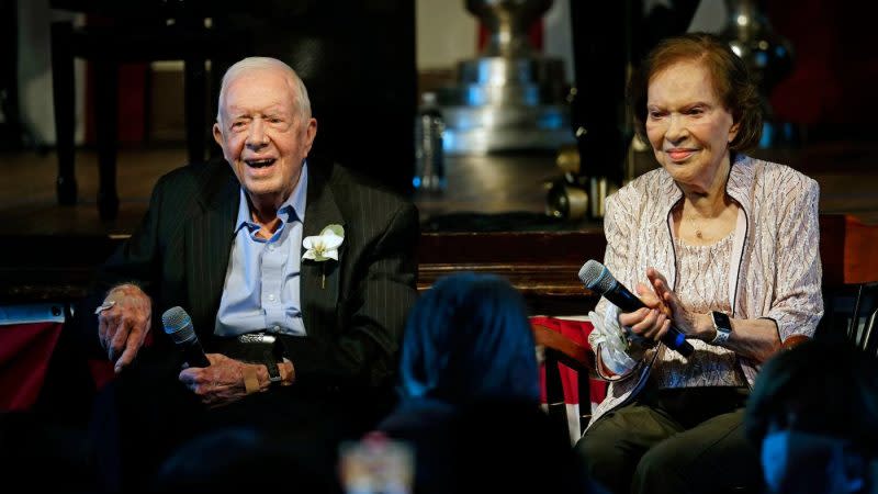 FILE – Former President Jimmy Carter and his wife former first lady Rosalynn Carter sit together during a reception to celebrate their 75th wedding anniversary on July 10, 2021, in Plains, Ga. (AP Photo/John Bazemore, Pool, File)