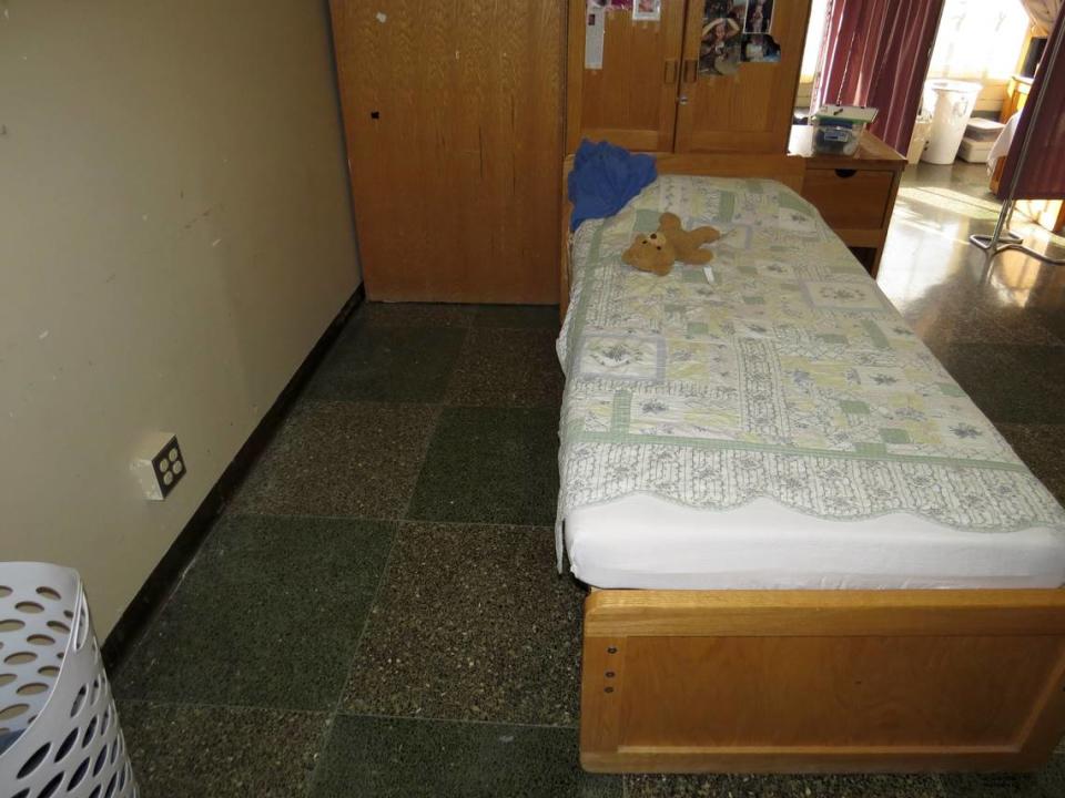 An image of Reichard’s bed that was included in the police report. Closer images show blood splatter on the floor and the wall.