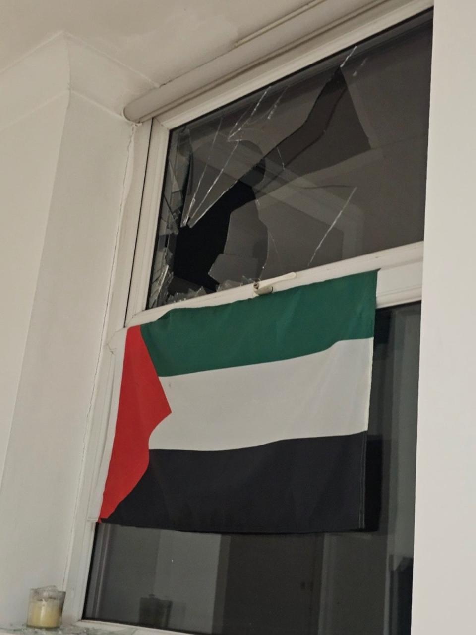 A doctor says he had a rock thrown through the window of his home in Manchester after displaying a Palestinian flag (Supplied)