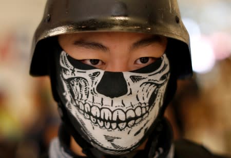 An anti-government protester is seen at Yoho Mall, near Yuen Long station, in Hong Kong