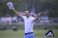 Patrick Cantlay reacts after sinking in his putt on the 18th green, the sixth playoff hole of the final round of the BMW Championship golf tournament, Sunday, Aug. 29, 2021, at Caves Valley Golf Club in Owings Mills, Md. (AP Photo/Nick Wass)