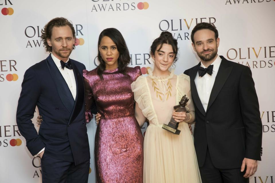 Actor Tom Hiddleston, from left, actors Zawe Ashton, Patsy Ferran and Charlie Cox pose for photographers backstage at the Olivier Awards in London, Sunday, April 7, 2019. (Photo by Vianney Le Caer/Invision/AP)