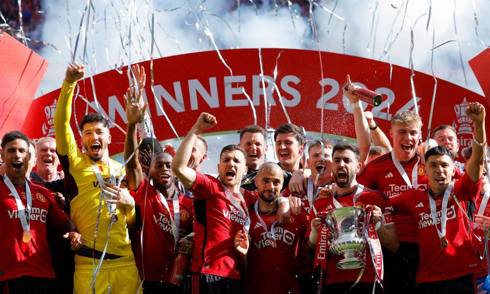 <span>Bruno Fernandes of Manchester United lifts the FA Cup after the 2-1 victory at Wembley.</span><span>Photograph: Tom Jenkins/The Observer</span>