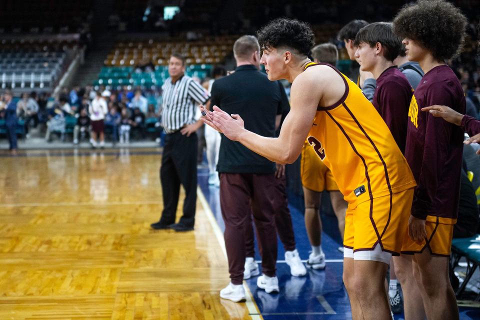 Windsor's Johnathan Reed cheers from the bench with seconds left during a class 5A Final 4 game against Vista PEAK Prep at the Denver Coliseum in Denver, Colo., on Thursday, March 7, 2024