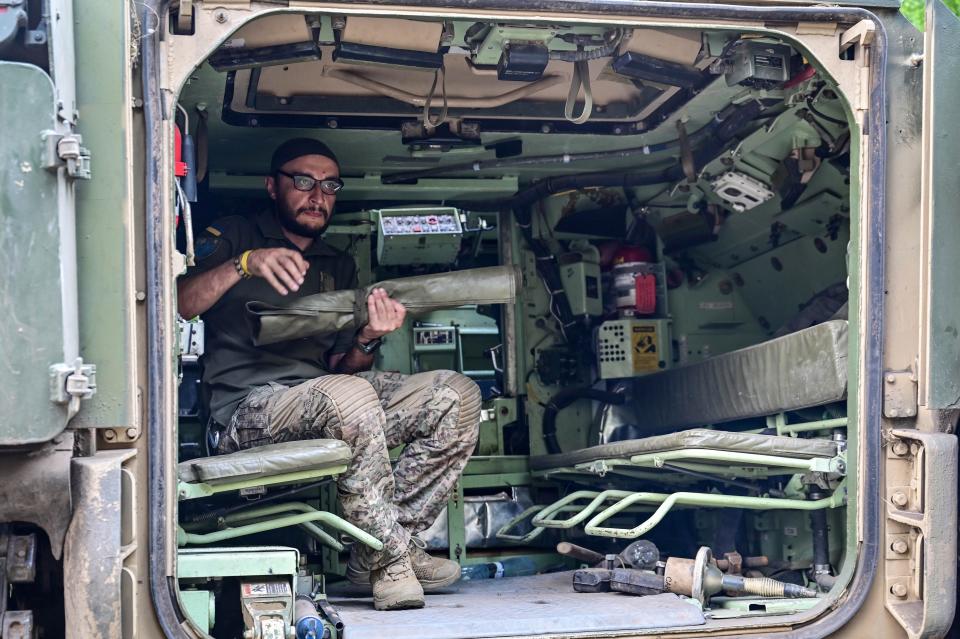 Gunner 'Molfar', 39, a Bradley IFV crew member of the 47th Magura Mechanized Brigade who took part in the fighting to liberate Robotyne village from Russian invaders, is seen inside a vehicle, Zaporizhzhia direction, southeastern Ukraine.