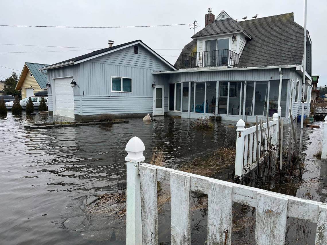 Flood waters threaten homes near Sucia Drive and Thetis Street on Sandy Point Thursday, Dec. 29, northwest of Bellingham.