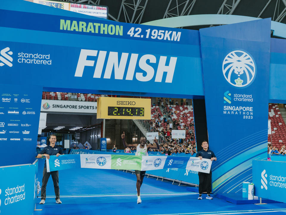 Kenya's David Barmasai Tumo crosses the finishing line to win the elite men's category at the 2023 Standard Chartered Singapore Marathon.