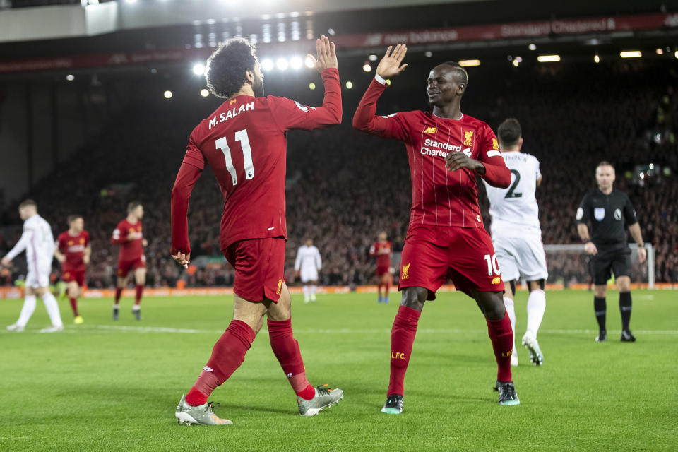 LIVERPOOL, ENGLAND - JANUARY 02: Mohamed Salah of Liverpool celebrates with Sadio Mane of Liverpool  after scoring their first goal to make the score 1-0 during the Premier League match between Liverpool FC and Sheffield United at Anfield on January 2, 2020 in Liverpool, United Kingdom. (Photo by Daniel Chesterton/Offside/Offside via Getty Images)