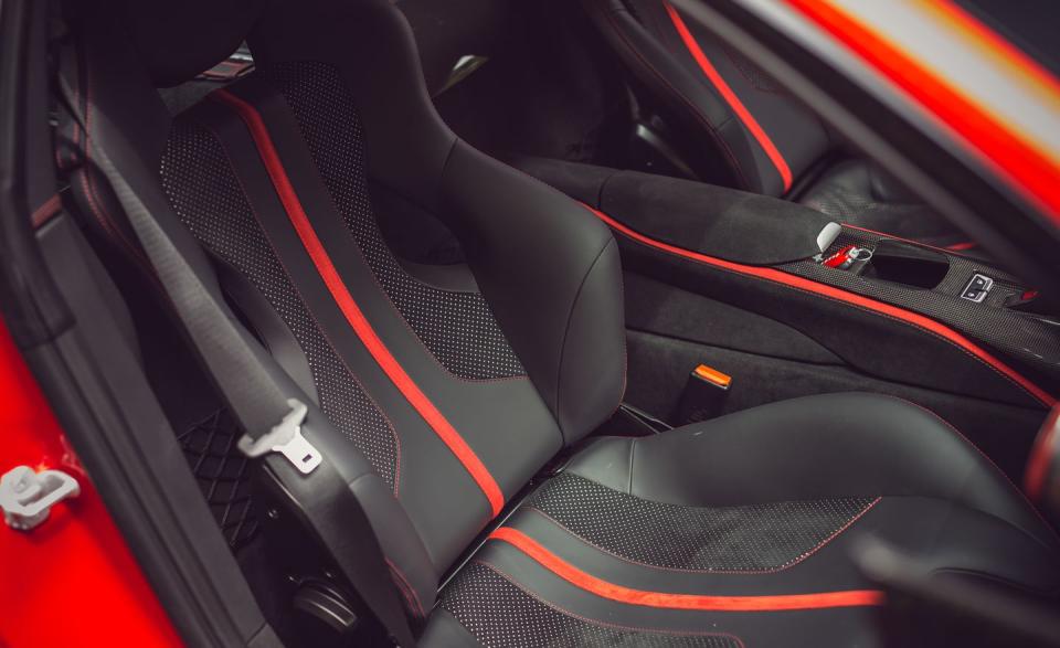 <p>The carbon-fiber racing seats aren't the most comfortable design for a long haul, and if one were to attempt a coast-to-coast run in an 812, that's an option we'd avoid.</p>