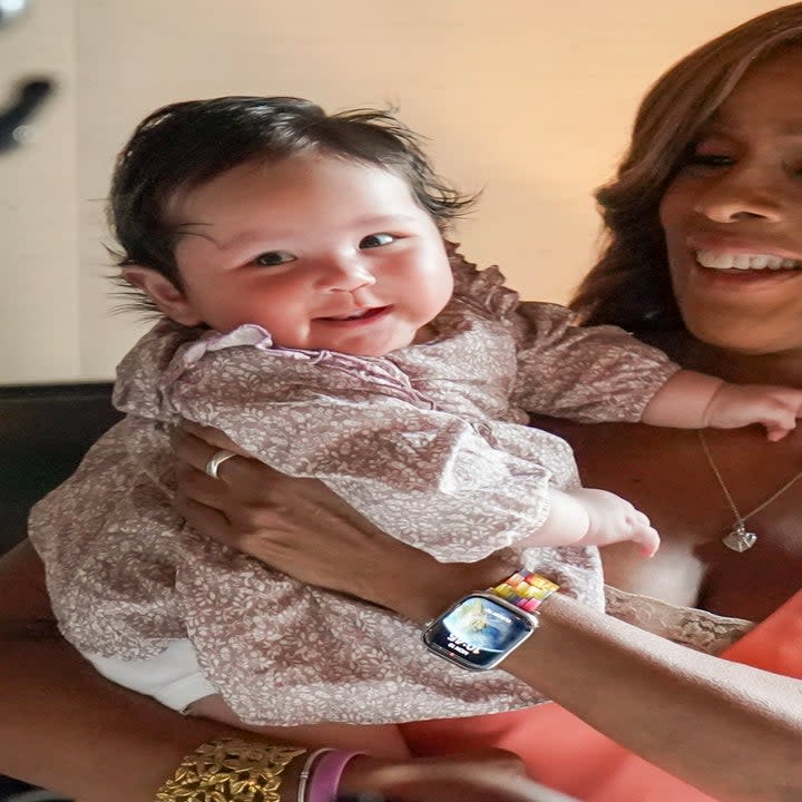 Screenshot of Tiffany with Gia, who is being held by Gayle King on CBS Mornings