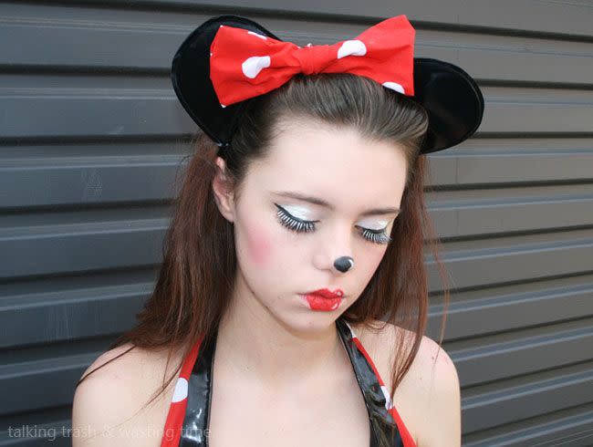 <p>Paired with a big polka dot bow, those red lips and black nose are iconically Minnie. Add white highlights for a cartoon-ish look.</p><p><strong>Get the tutorial at <a href="http://www.nowthatspeachy.com/2013/01/minnie-mouse-cartoon-make-up-how-to.html" rel="nofollow noopener" target="_blank" data-ylk="slk:Now That's Peachy;elm:context_link;itc:0;sec:content-canvas" class="link ">Now That's Peachy</a>.</strong> </p>