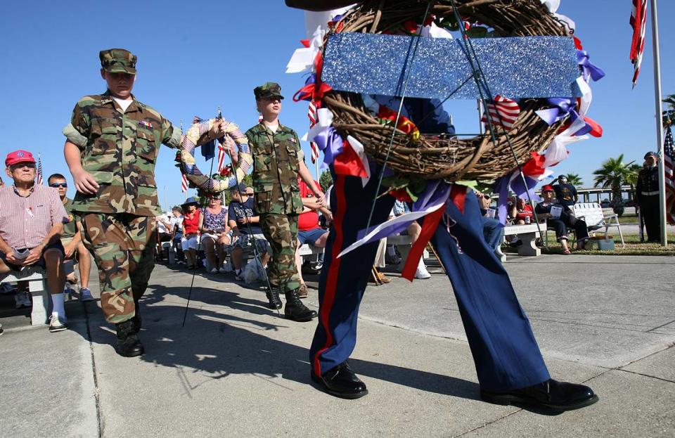 Various military and veterans’ groups bring memorial wreaths to place during the Memorial Day 2001 program at the Veteran’s Memorial on the Manatee River.