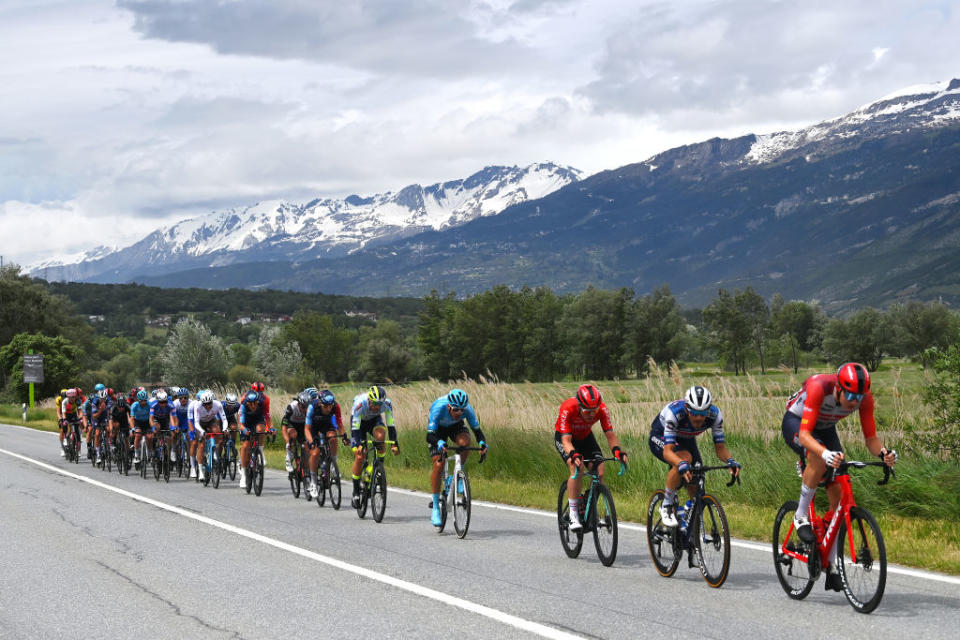 CASSANO MAGNAGO ITALY  MAY 20 A general view of Davide Ballerini of Italy Pieter Serry of Belgium and Team Soudal  Quick Step Nicolas Prodhomme of France Larry Warbasse of The United States and AG2R Citron Team Christian Scaroni of Italy and Astana Qazaqstan Team Andrea Pasqualon of Italy Jasha Stterlin of Germany and Team Bahrain  Victorious Nico Denz of Germany and Team BORA  hansgrohe Alberto Bettiol of Italy and Team EF EducationEasyPost Davide Bais of Italy and Team EOLOKometa Henok Mulubrhan of Eritrea and Team Green ProjectBardiani CSFFaizan Bruno Armirail of France and Team Groupama  FDJ Laurenz Rex of Belgium and Team Intermarch  Circus  Wanty Fernando Gaviria of Colombia and Movistar Team Marius Mayrhofer of Germany and Team DSM Alessandro De Marchi of Italy and Team Jayco AlUla Bauke Mollema of The Netherlands and Otto Vergaerde of Belgium and Team Trek  Segafredo compete in the breakaway passing through a Baltschieder village during the 106th Giro dItalia 2023 Stage 14 a 194km stage from Sierre to Cassano Magnago  UCIWT  on May 20 2023 in Cassano Magnago Italy Photo by Tim de WaeleGetty Images