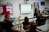 Former Sandy Hook teacher Kaitlin Roig speaks to teachers and staff members about her experience during the Sandy Hook shooting, at an active shooter training at James I. O'Neill High School in Highland Falls, New York, U.S., December 12, 2017. REUTERS/Eduardo Munoz