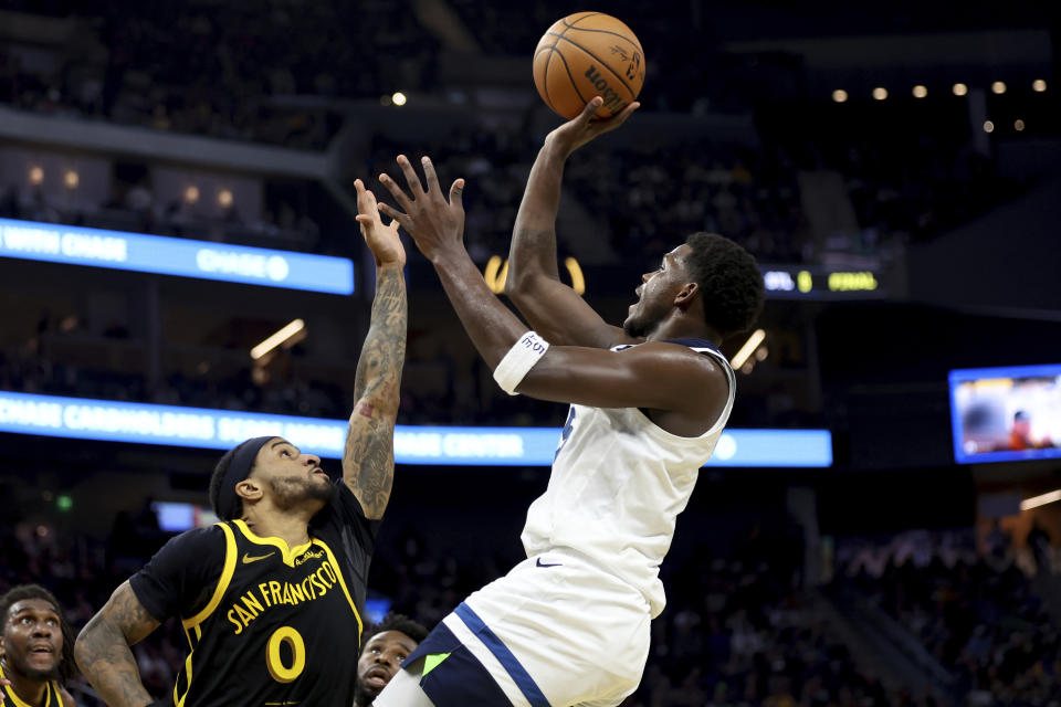 Minnesota Timberwolves guard Anthony Edwards, right, shoots against Golden State Warriors guard Gary Payton II (0) during the first half of an in-season NBA tournament basketball game in San Francisco, Tuesday, Nov. 14, 2023. (AP Photo/Jed Jacobsohn)