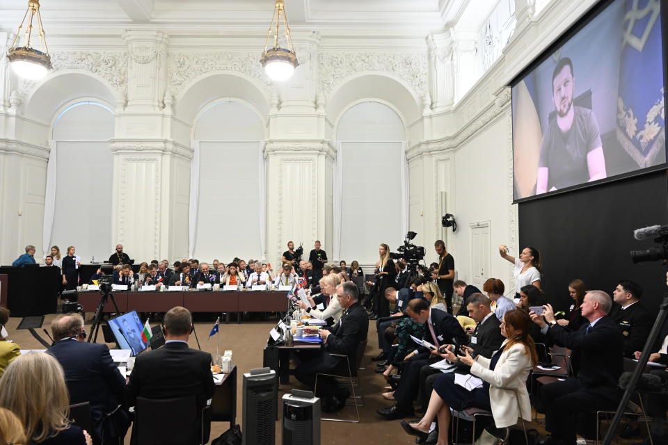 Ukraine's President Volodymyr Zelenskiy speaks via video-link at a donor conference for Ukraine held at Christiansborg in Copenhagen, Thursday, Aug. 11, 2022. The international donation conference will strengthen the long-term support for Ukraine with discussions on how financing, weapons production, training and demining can be strengthened going forward. (Philip Davali/Ritzau Scanpix via AP)