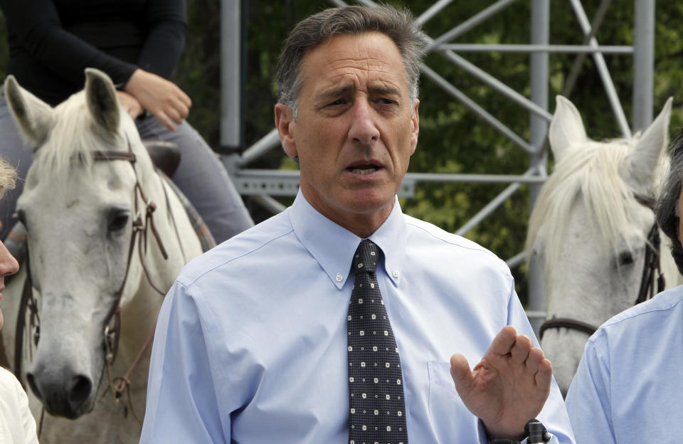 Gov. Peter Shumlin, with the backdrop of a couple of horses, holds a news conference on Wednesday, June 6, 2012 in Plainfield, Vt. Broadband computer services are now available to 4,000 rural customers in north central Vermont. Gov. Peter Shumlin helped Vermont's Cloud alliance announce that it had added four new towers that will expand service to homes and businesses in Woodbury, Hardwick, Wolcott and parts of Elmore, Greensboro, Walden and Cabot. (AP Photo/Toby Talbot)