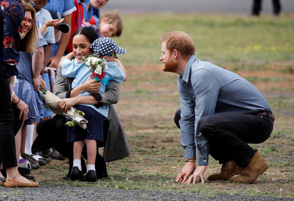 Meghan hugs Luke Vincent, 5, in Dubbo (PA)