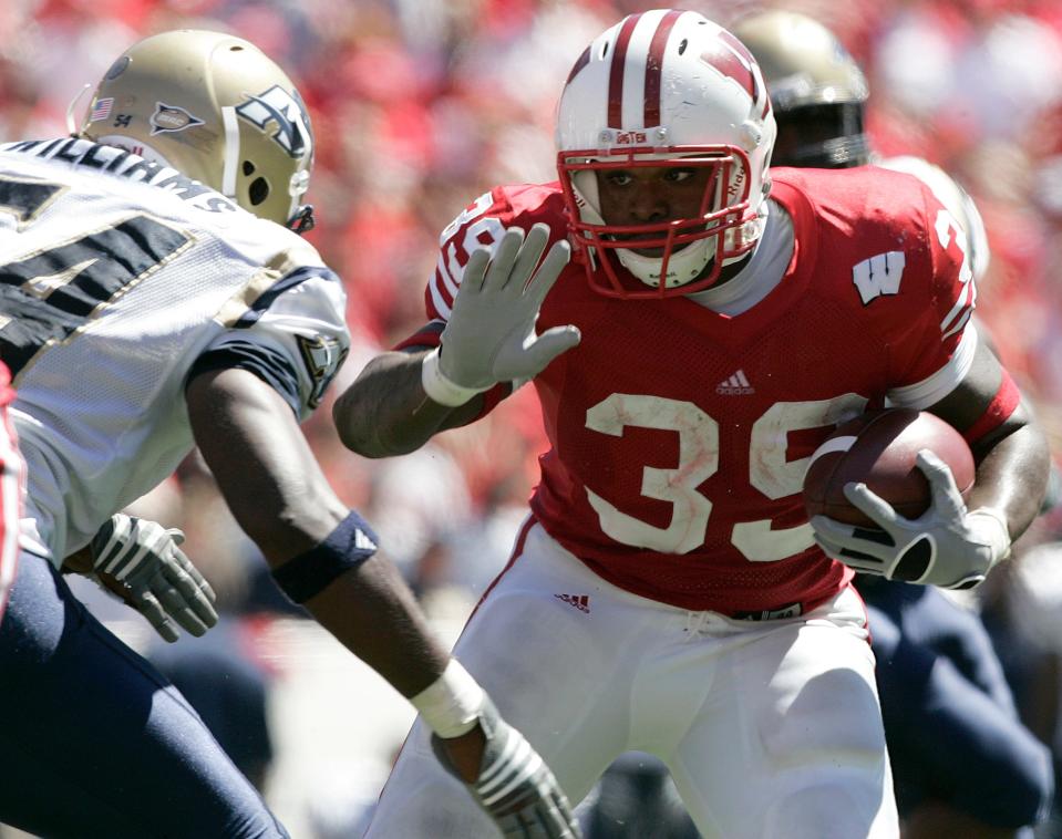 P.J. Hill ran for 1,569 yards as a freshman and was third on UW's all-time rushing list when he left after three seasons.