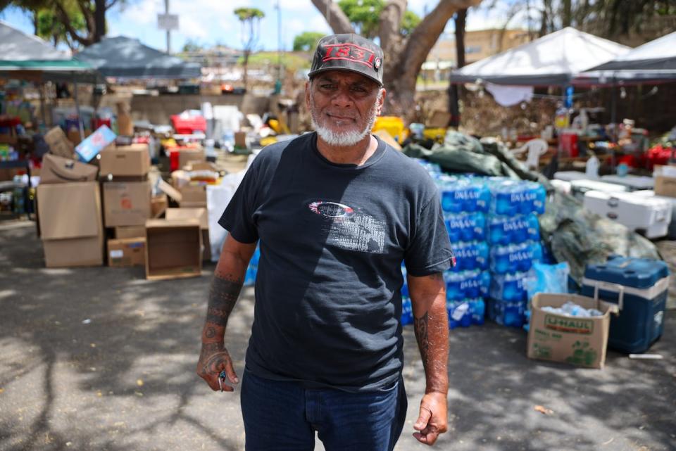 Keʻeaumoku Kapu has been handing out water, clothes, and emergency supplies to families in need out of the Walgreens parking lot in Lahaina.