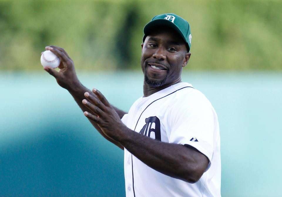 Mateen Cleaves throws out a ceremonial first pitch before the Detroit Tigers baseball game against the Texas Rangers on Aug. 21, 2015, in Detroit. (Photo: ASSOCIATED PRESS)