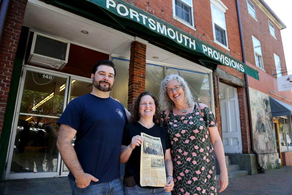 From left, owners Greg and Beth Danilowski along with Beth's sister, Meredith Richardson, are excited for the re-opening of Richardson's Market in Portsmouth on Thursday, June 23, 2022. Beth Danilowksi holds a Portsmouth Herald article from 2019 about her parents, former Richardson's owners Basil A. and Louise Richardson, and their Washington Street business, Modern Launderette.