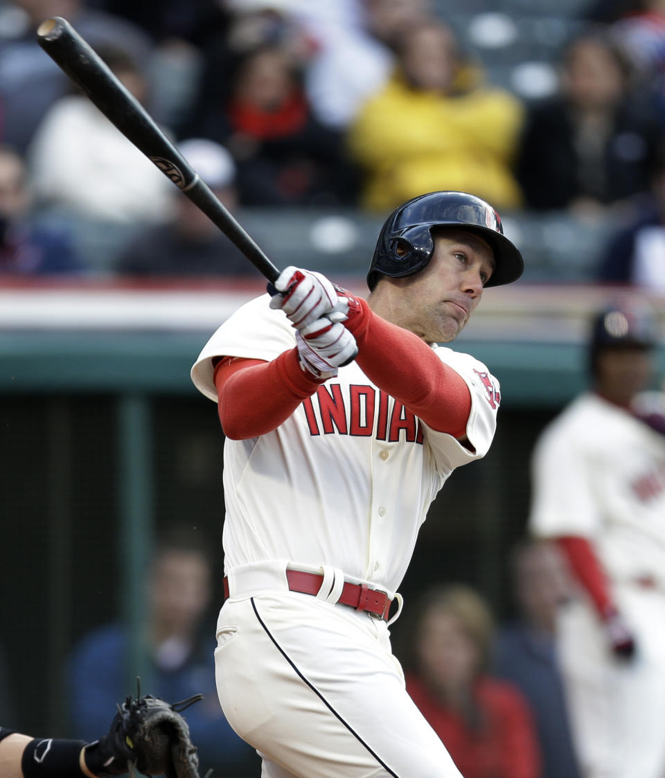 Cleveland Indians' David Murphy hits against Chicago White Sox starting pitcher Scott Carroll during the second inning of a baseball game, Saturday, May 3, 2014, in Cleveland. Murphy was safe at first base on an error by Marcus Semien. Lonnie Chisenhall scored. (AP Photo/Tony Dejak)