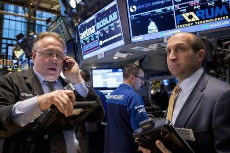 Traders work on the floor of the New York Stock Exchange October 28, 2014. REUTERS/Brendan McDermid